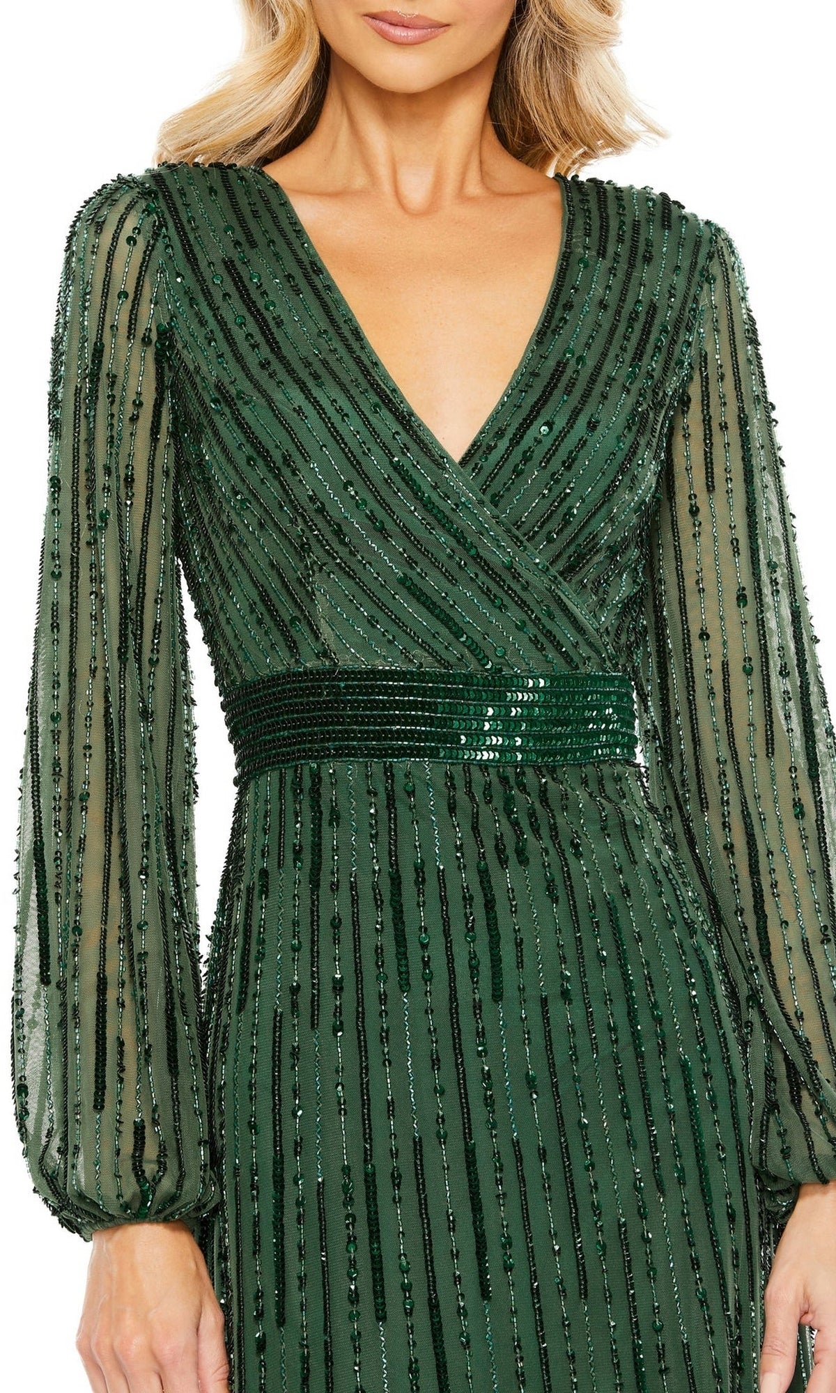 A woman wearing the Long Formal Dress 5718 by Mac Duggal—a dark green, floor-length gown with a V-neckline, sheer long sleeves, and beaded vertical stripes.